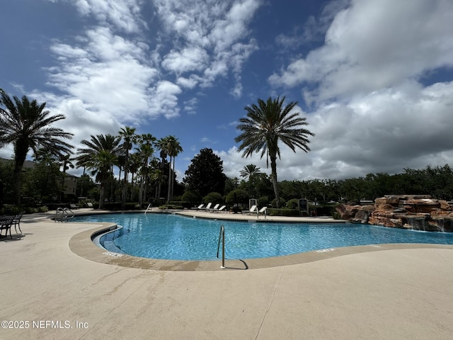 community pool featuring a patio area