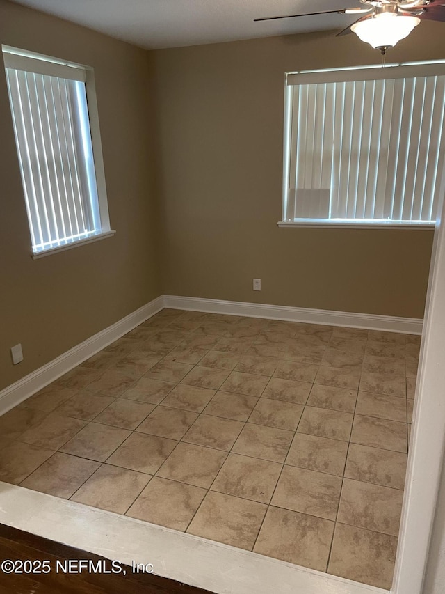 6938 Corkwood Rd, Jacksonville, FL 32277 - spare room with a ceiling fan and baseboards