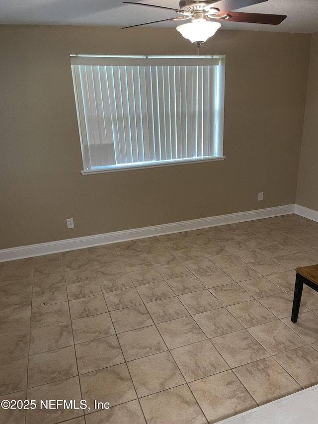 6938 Corkwood Rd, Jacksonville, FL 32277 - spare room with a ceiling fan and baseboards