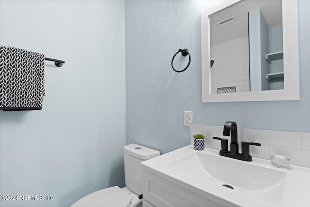 3385 Coastal Hwy Unit 23, Saint Augustine, FL 32084 - bathroom featuring vanity, a textured wall, visible vents, and toilet