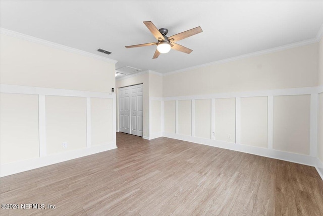 3385 Coastal Hwy Unit 23, Saint Augustine, FL 32084 - interior space featuring a ceiling fan, attic access, visible vents, crown molding, and wood finished floors