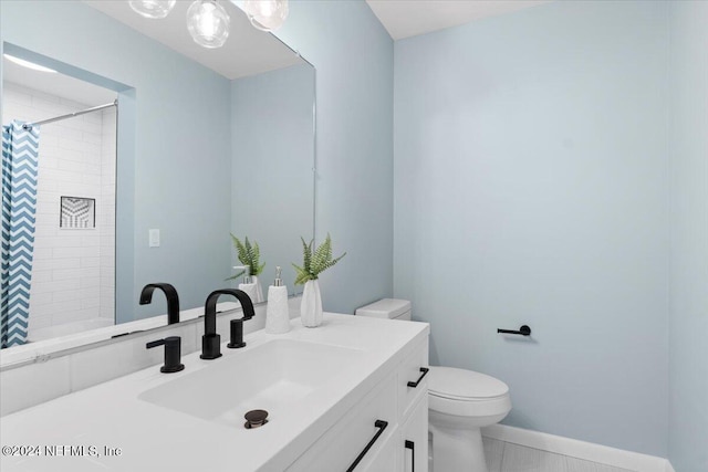 3385 Coastal Hwy Unit 23, Saint Augustine, FL 32084 - bathroom with vanity, baseboards, toilet, and a shower with shower curtain