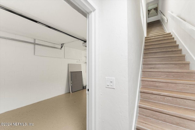 3385 Coastal Hwy Unit 23, Saint Augustine, FL 32084 - staircase featuring concrete block wall