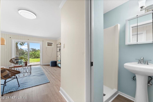 3385 Coastal Hwy Unit 23, Saint Augustine, FL 32084 - interior space with a sink, baseboards, wood finished floors, ornamental molding, and a stall shower