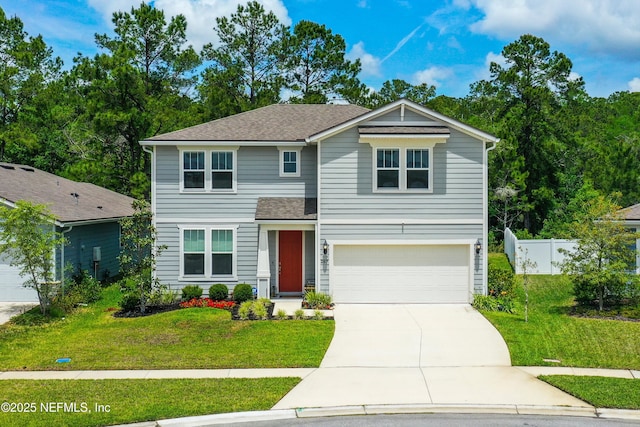 view of front of house featuring fence, an attached garage, concrete driveway, and a front lawn