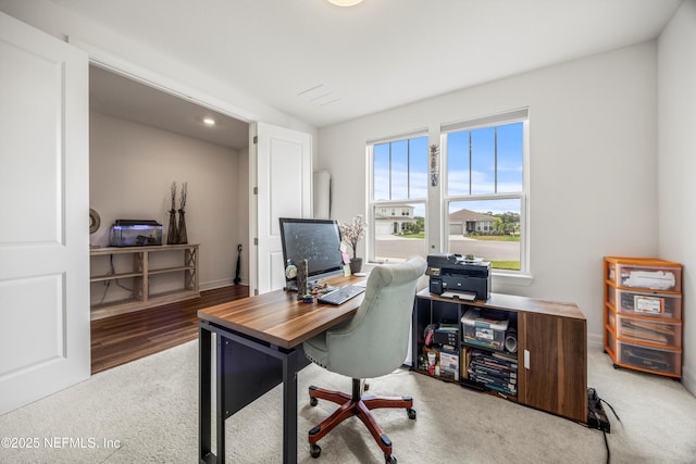 carpeted office space featuring recessed lighting and baseboards