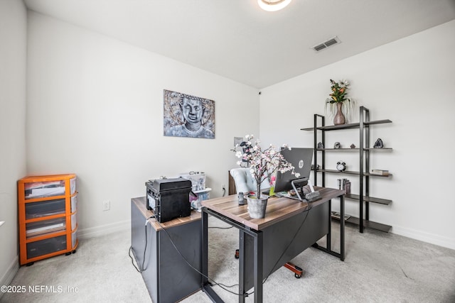 office space with carpet floors, baseboards, and visible vents