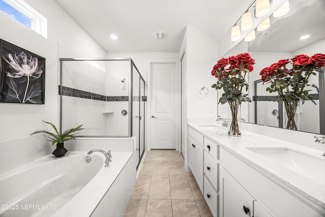 full bath with double vanity, a sink, a bath, and a stall shower
