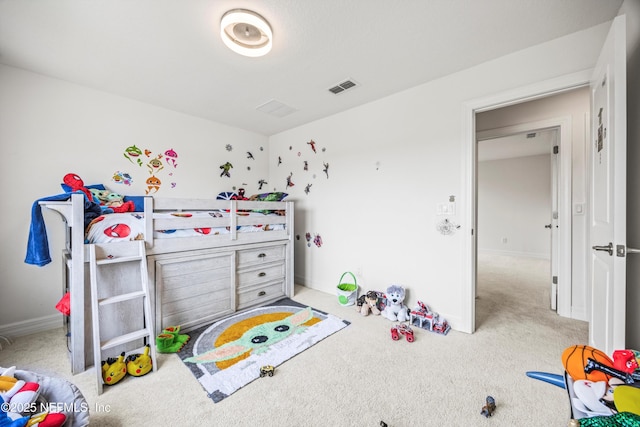carpeted bedroom featuring baseboards and visible vents