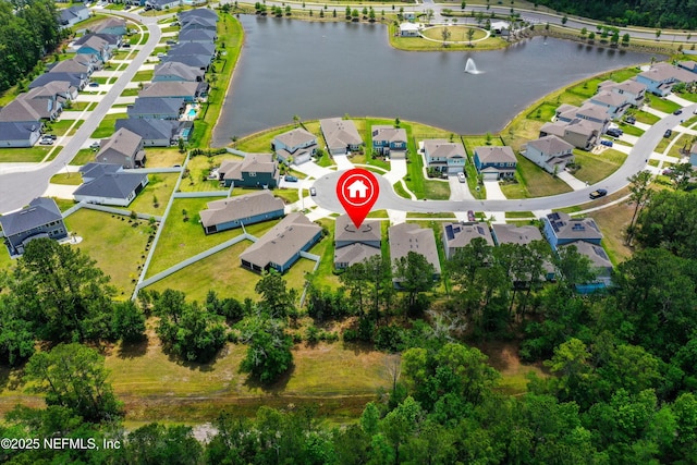 bird's eye view with a residential view and a water view