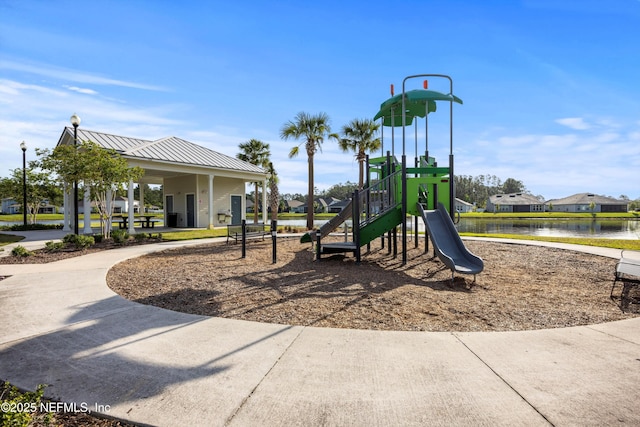 community play area featuring a residential view and a water view