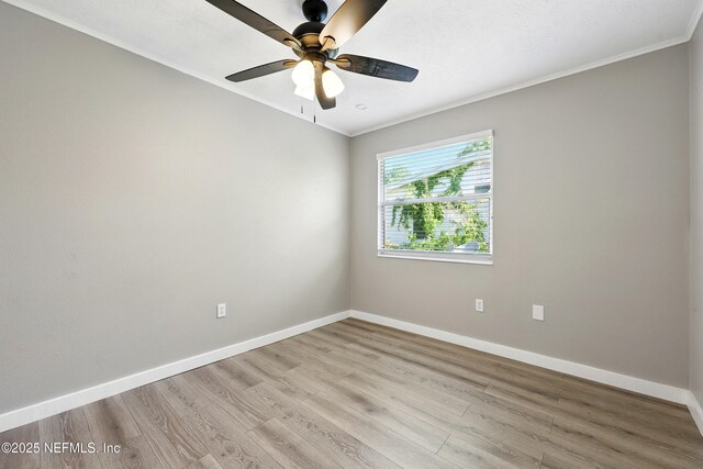 367 Orange Ave, Baldwin, FL 32234 - spare room with crown molding, baseboards, and light wood finished floors