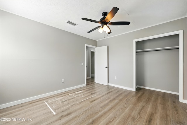 367 Orange Ave, Baldwin, FL 32234 - unfurnished bedroom featuring a closet, baseboards, visible vents, and light wood-type flooring