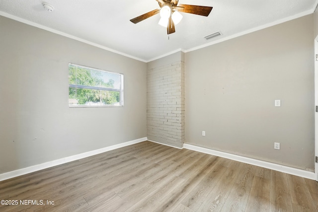 367 Orange Ave, Baldwin, FL 32234 - spare room featuring visible vents, crown molding, wood finished floors, baseboards, and ceiling fan
