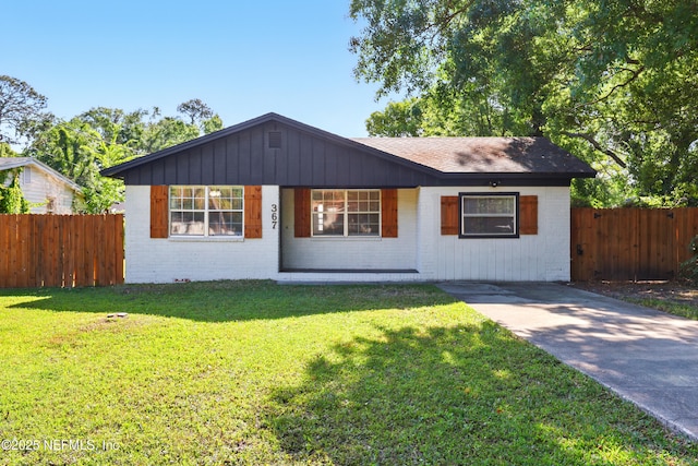 367 Orange Ave, Baldwin, FL 32234 - bungalow-style house featuring brick siding, a front lawn, fence, and a porch