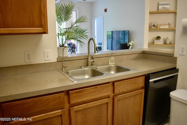 kitchen featuring a sink, light countertops, brown cabinetry, and dishwasher