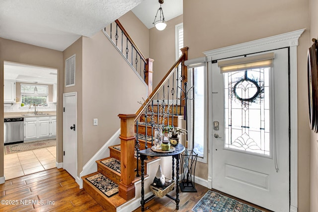 50 Jefferson Ave, Ponte Vedra Beach, FL 32082 - foyer featuring stairway, baseboards, visible vents, and light wood-style floors