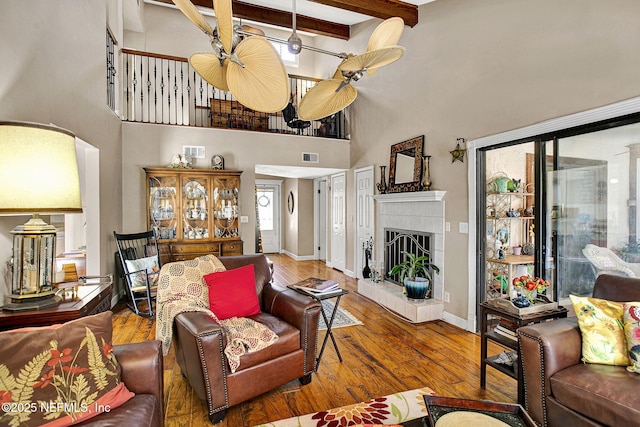 50 Jefferson Ave, Ponte Vedra Beach, FL 32082 - living room featuring beamed ceiling, visible vents, a towering ceiling, and hardwood / wood-style flooring