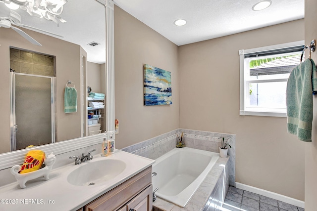 50 Jefferson Ave, Ponte Vedra Beach, FL 32082 - bathroom with a garden tub, tile patterned flooring, vanity, ceiling fan, and a stall shower