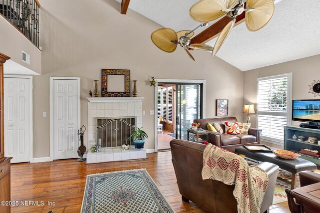 50 Jefferson Ave, Ponte Vedra Beach, FL 32082 - living area featuring baseboards, visible vents, ceiling fan, wood finished floors, and a fireplace