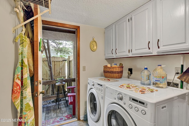 50 Jefferson Ave, Ponte Vedra Beach, FL 32082 - washroom with washer and clothes dryer, a textured ceiling, and cabinet space