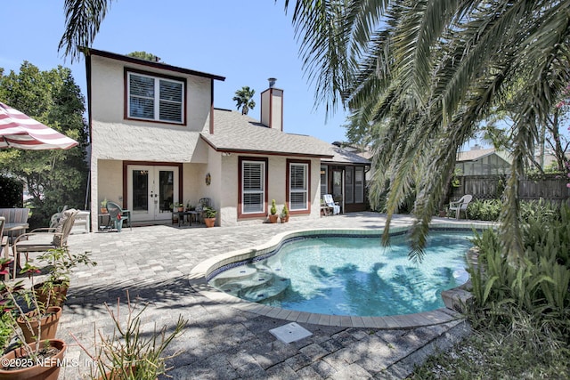 50 Jefferson Ave, Ponte Vedra Beach, FL 32082 - view of pool with fence, a fenced in pool, french doors, and a patio area