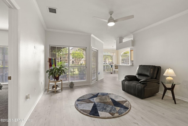 10961 Burnt Mill Rd Unit 318, Jacksonville, FL 32256 - sitting room featuring visible vents, ornamental molding, wood finished floors, baseboards, and ceiling fan with notable chandelier