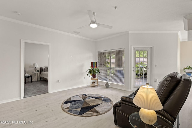 10961 Burnt Mill Rd Unit 318, Jacksonville, FL 32256 - living area featuring crown molding, ceiling fan, baseboards, and wood finished floors