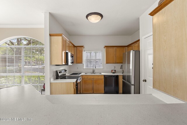 10961 Burnt Mill Rd Unit 318, Jacksonville, FL 32256 - kitchen with light countertops, a sink, brown cabinetry, and stainless steel appliances