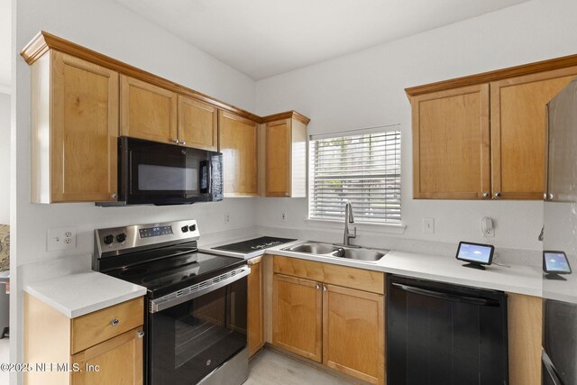 10961 Burnt Mill Rd Unit 318, Jacksonville, FL 32256 - kitchen featuring black microwave, stainless steel electric range oven, dishwasher, light countertops, and a sink