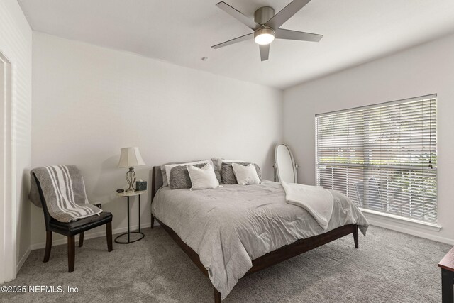 10961 Burnt Mill Rd Unit 318, Jacksonville, FL 32256 - carpeted bedroom with baseboards and ceiling fan