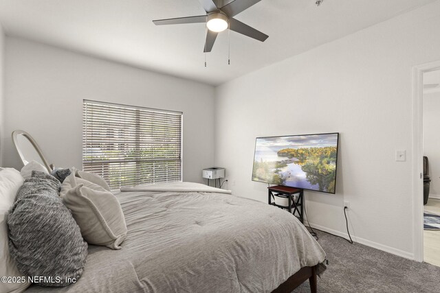 10961 Burnt Mill Rd Unit 318, Jacksonville, FL 32256 - bedroom featuring baseboards, ceiling fan, and carpet