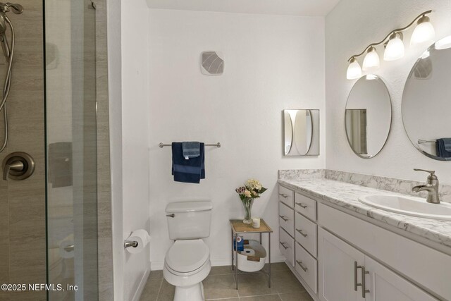 10961 Burnt Mill Rd Unit 318, Jacksonville, FL 32256 - full bath featuring tile patterned flooring, vanity, toilet, and tiled shower