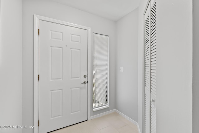 1909 University Blvd S Unit 204, Jacksonville, FL 32216 - entrance foyer with baseboards and light tile patterned flooring