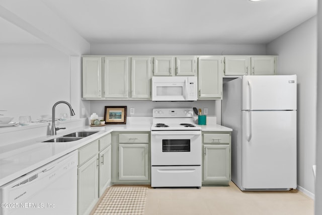 1909 University Blvd S Unit 204, Jacksonville, FL 32216 - kitchen featuring light countertops, light tile patterned flooring, a sink, and white appliances