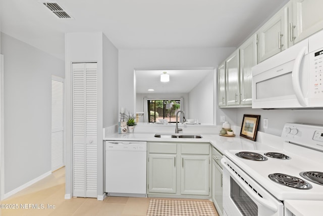 1909 University Blvd S Unit 204, Jacksonville, FL 32216 - kitchen with white appliances, light countertops, visible vents, and a sink