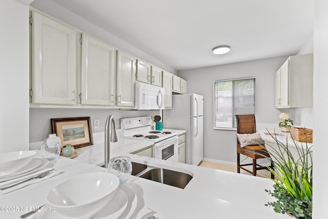1909 University Blvd S Unit 204, Jacksonville, FL 32216 - kitchen featuring white appliances, light countertops, and baseboards