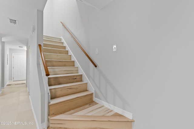 1909 University Blvd S Unit 204, Jacksonville, FL 32216 - staircase with baseboards and visible vents