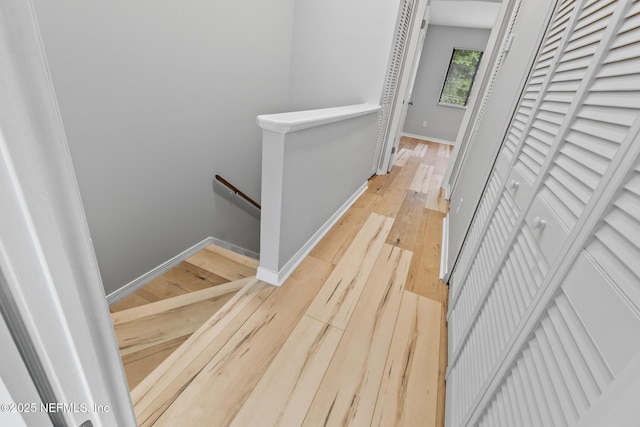 1909 University Blvd S Unit 204, Jacksonville, FL 32216 - corridor featuring light wood finished floors, an upstairs landing, and baseboards