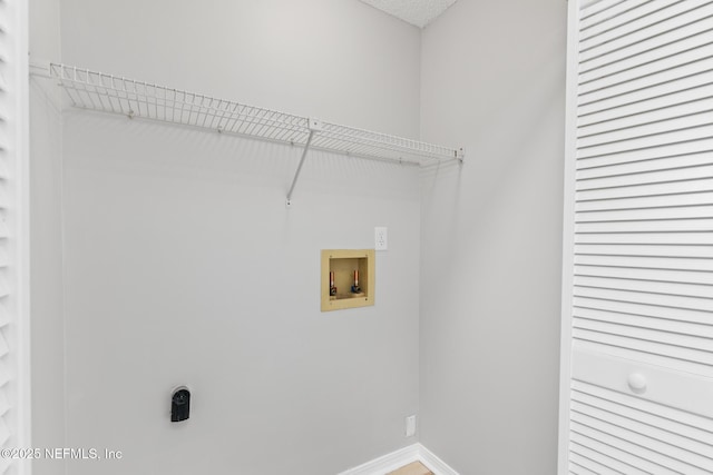 1909 University Blvd S Unit 204, Jacksonville, FL 32216 - clothes washing area with laundry area, electric dryer hookup, washer hookup, and baseboards