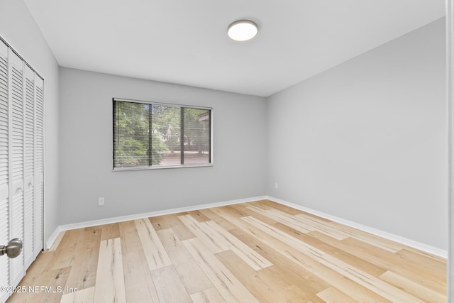 1909 University Blvd S Unit 204, Jacksonville, FL 32216 - unfurnished bedroom with a closet, wood finished floors, and baseboards