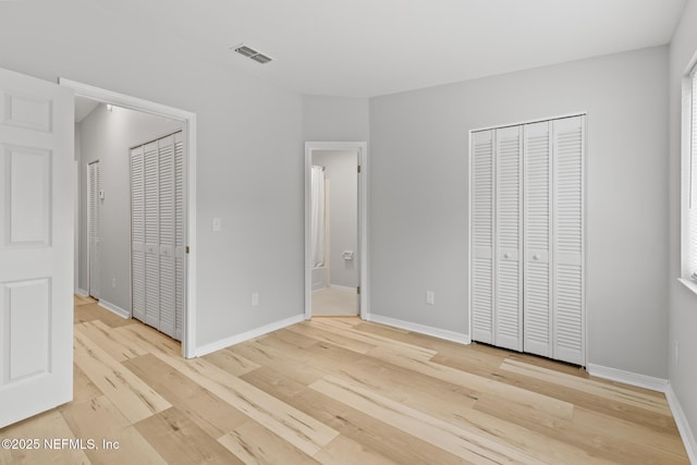 1909 University Blvd S Unit 204, Jacksonville, FL 32216 - unfurnished bedroom with light wood-style flooring, baseboards, and visible vents