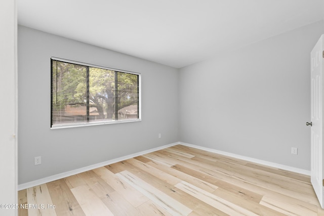 1909 University Blvd S Unit 204, Jacksonville, FL 32216 - empty room with light wood-style flooring and baseboards