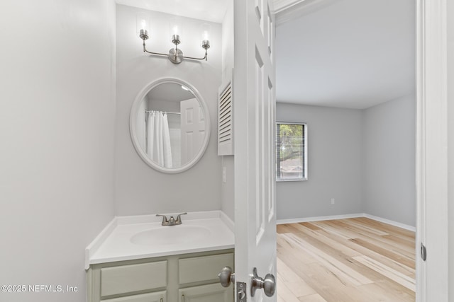 1909 University Blvd S Unit 204, Jacksonville, FL 32216 - full bath featuring baseboards, wood finished floors, and vanity