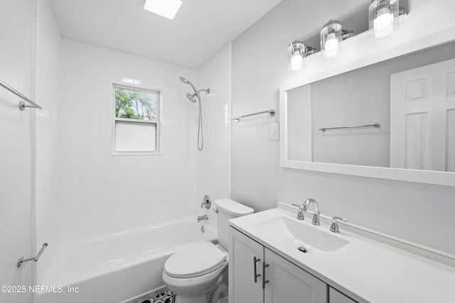 full bathroom featuring toilet, washtub / shower combination, and vanity