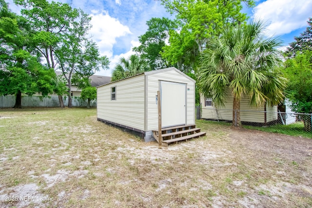 view of shed featuring a fenced backyard