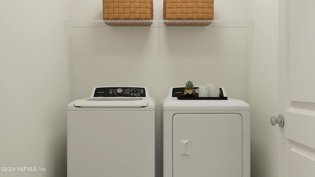 washroom featuring independent washer and dryer and laundry area
