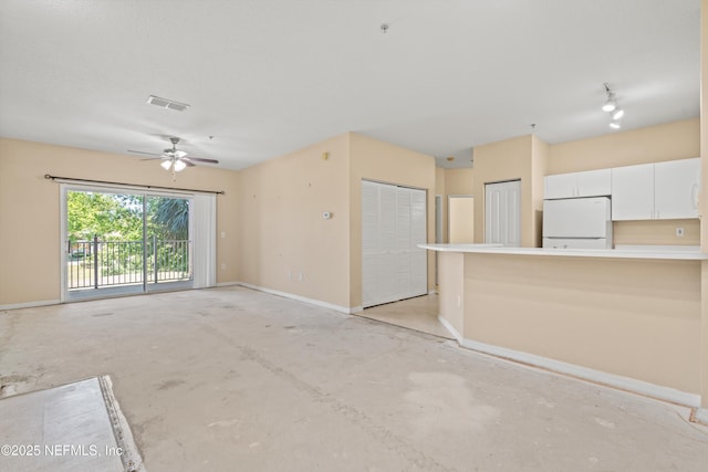 unfurnished living room with baseboards, visible vents, concrete floors, and ceiling fan