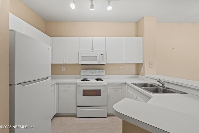 kitchen featuring a sink, white cabinetry, white appliances, and light countertops