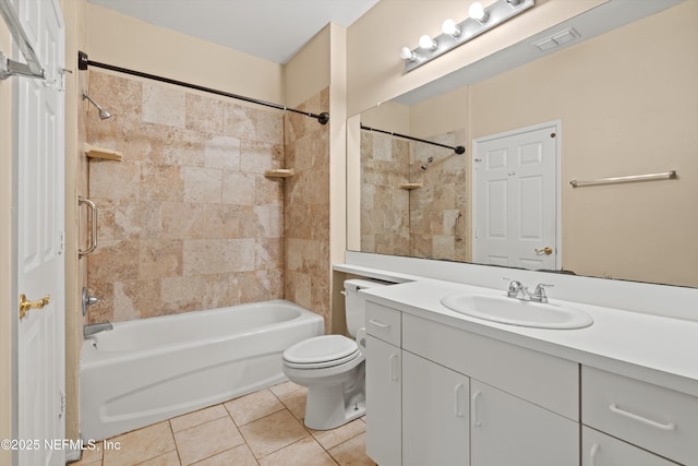 bathroom featuring visible vents, tile patterned flooring, vanity, toilet, and bathing tub / shower combination